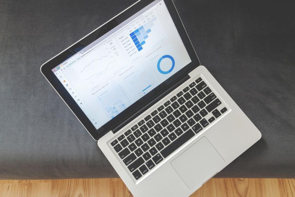 laptop screen showing website analytics dashboard with charts