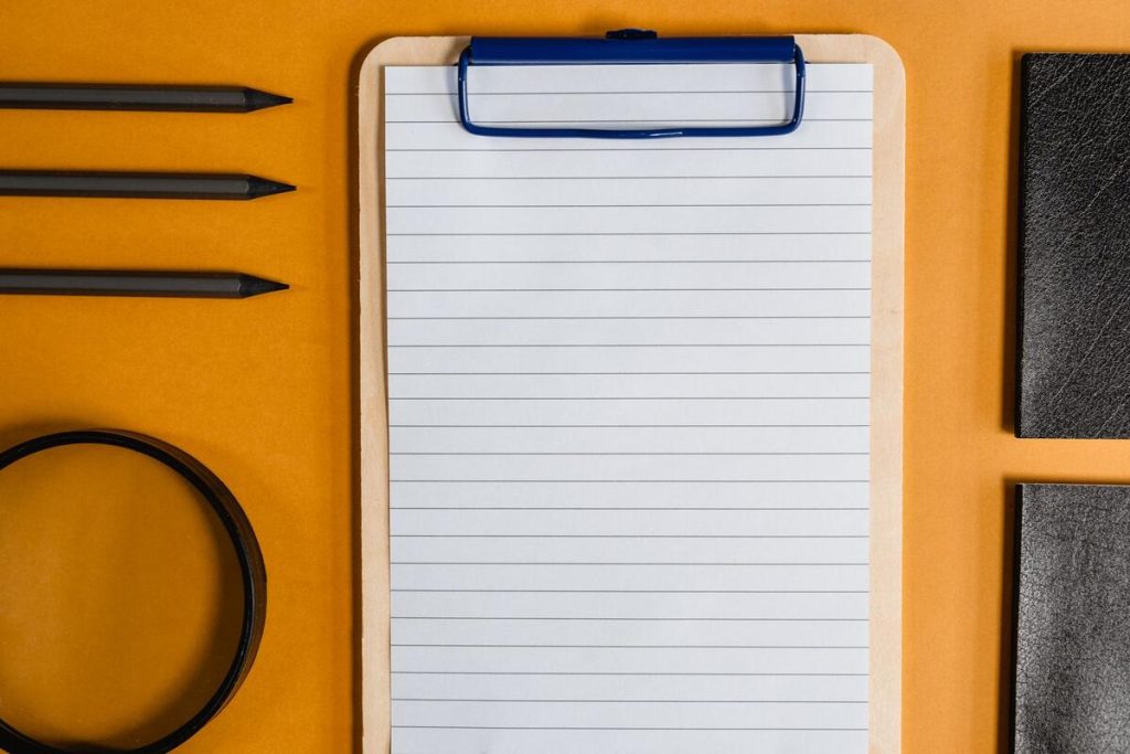 clipboard with website structure diagram and magnifying glass, flat lay, no people