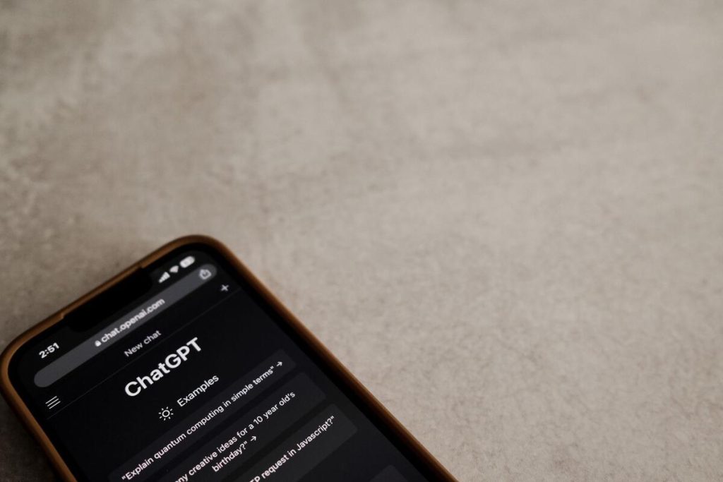 close up of smartphone screen displaying a chat conversation interface, no visible faces