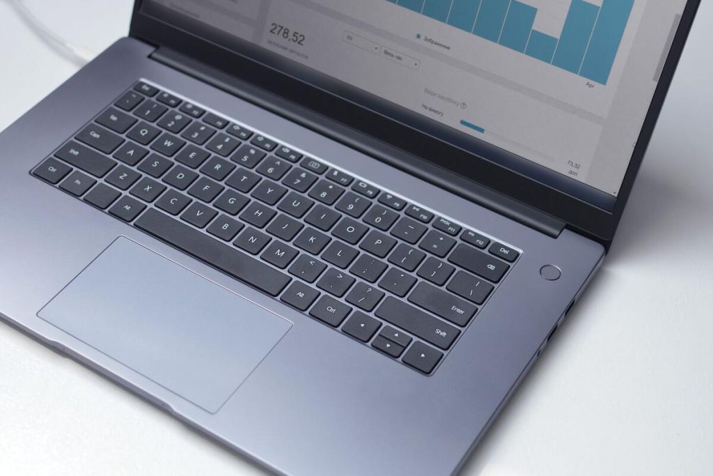 analytics dashboard on laptop screen showing traffic graph, office desk, no people