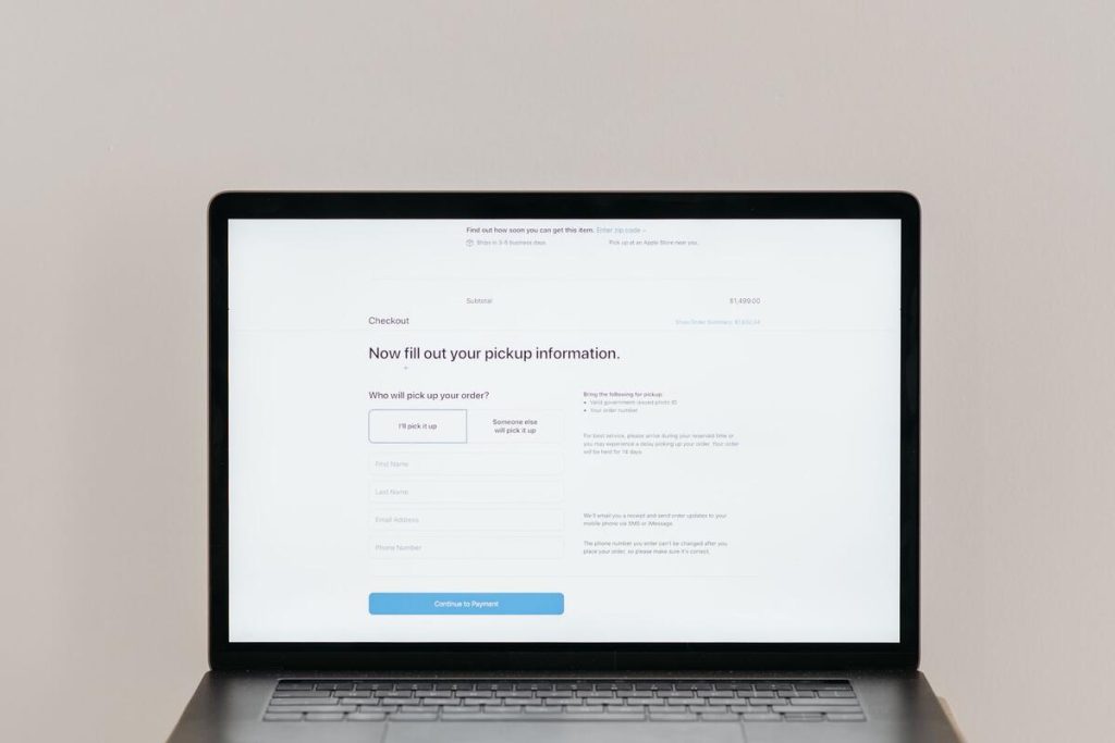 laptop screen showing an online store checkout page, flat lay, no people
