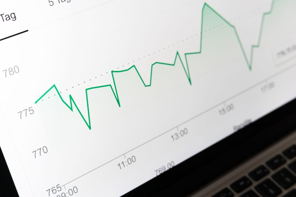 marketing analytics graph with upward trend line on a monitor