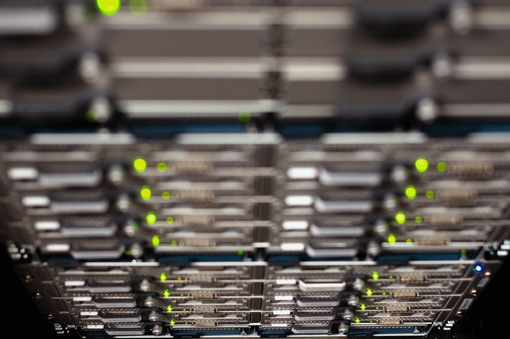 close up photo of server room with network cables and blinking lights, no people