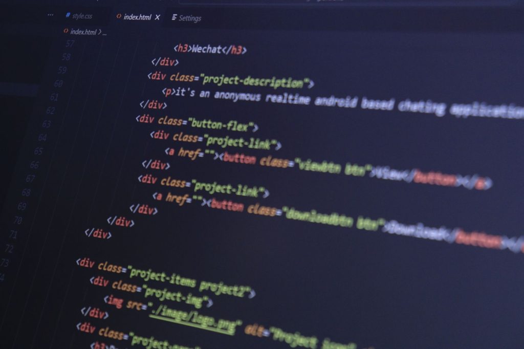 web developer code editor showing image file format tags on a computer screen